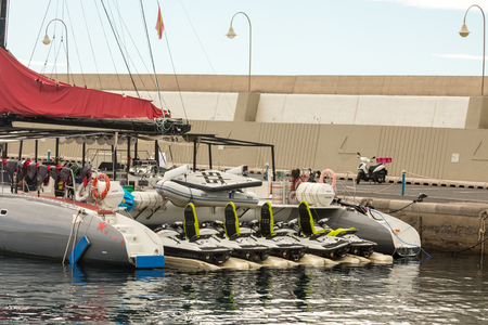 Puerto Rico, Gran Canaria - December 16, 2017: Marina of Puerto Rico. Many companies offers boat trips for fishing and sightseeing, this sailboat has watercraft jets in the aft.のeditorial素材