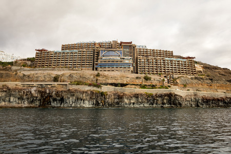 Amadores, Gran Canaria in Spain - December 16, 2017: Gloria Palace hotel, seen from the sea. Cloudy sky.のeditorial素材
