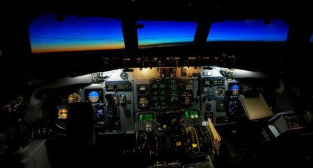 View of a plane cockpit in flight toward a sunset