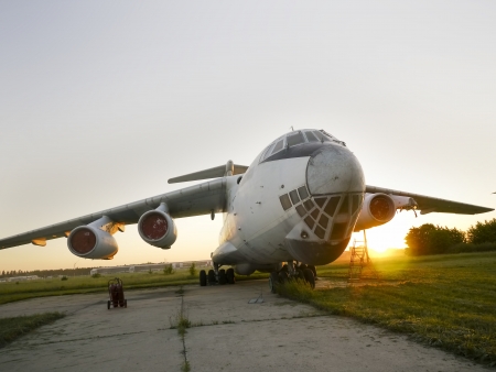 Abandoned russian aircrafts lighted from the warm light at sunsetの写真素材