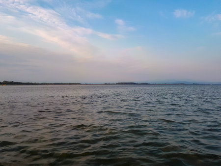 Surface level shot of adriatic sea against sky in daytime in summer in Grado, Italy