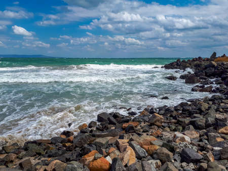 Rocky coast at the Black Sea against cloudy sky in Pomorie, Burgas Bay, Bulgaria.の写真素材