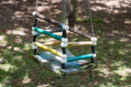 A swing in the park on a sunny day, close-up