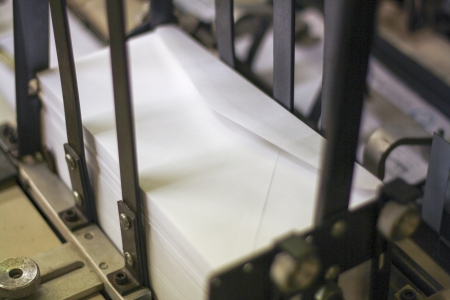 envelopes in mail sorter ready for postageの写真素材