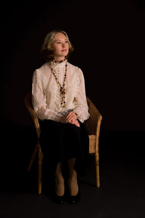 Beautiful woman in dream of happiness isolated on blackの写真素材