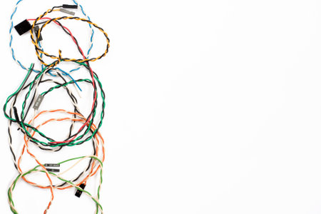 Colored cables and wires with connectors on white background. Colorful computer wires. Telecommunications. Blank for postcard with space for text. flat layの写真素材