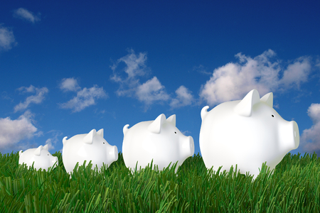 Piggy bank - family walk in the grassの写真素材