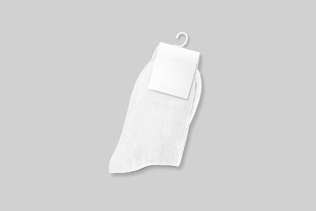 Blank New socks on a background. socks on hanger mockup with blank label for your design. Isolated object. 3d rendering.の写真素材