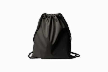 Black canvas drawstring backpack mockup, front view, 3d rendering. Empty linen or fabric haversack mock up, isolated. Clear cloth packing with strap template.の写真素材