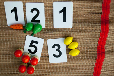 Early math with basic childish numbers wooden toy fruitsの写真素材