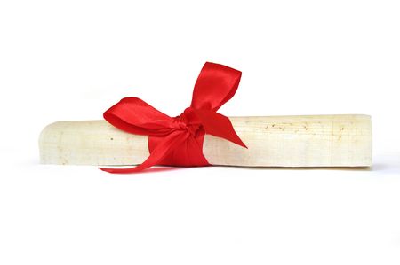 papyrus document with bow of red ribbonの写真素材