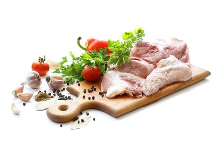 raw meat and different spices on wooden cutting boardの写真素材