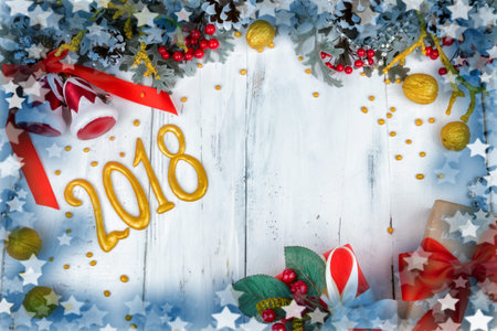 Christmas wooden white background with snow branch. Top view with copy space for your text