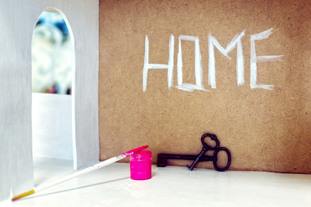 home security concept - little house and old key with tagの写真素材