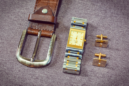 A set of clothes for the groom. Wedding shoes, belt, tie, perfume, cufflinks. The whole set of men is made in brown color. Luxury suite for real menの写真素材