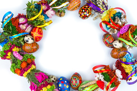 Easter eggs and willow branches on a white background