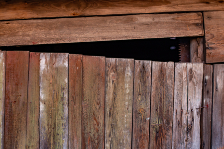 very old wooden door with a bad lockの写真素材