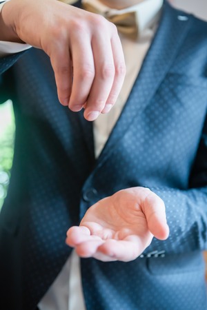 A set of clothes for the groom. Wedding shoes, belt, tie, perfume, cufflinks. The whole set of men is made in brown color. Luxury suite for real menの写真素材