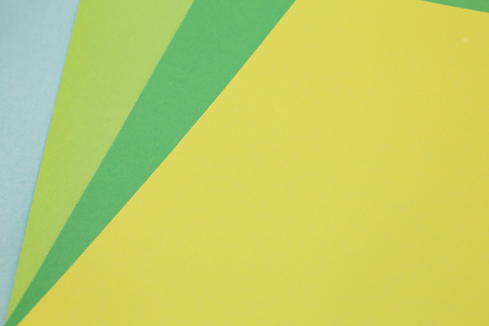 sheets of colored paper. Many colored sheets of paper are laid out in the harsh composition. background of colored paper. place for text. view from the topの写真素材
