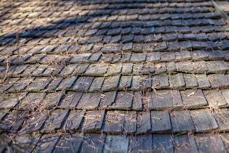 old wooden house, old windows, old building. wooden roof shingleの写真素材
