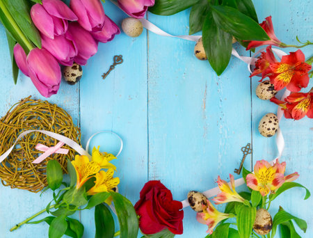 Pink tulips on wooden blue background. Conception holiday, March 8, Mothers Day. Flat lay and copy spaceの写真素材