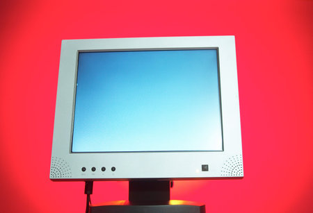 Studio shot of a computer screen on a pink background
