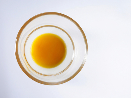 A top view of the egg in a small transparent bowlの写真素材