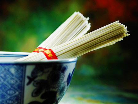 Two bundles of vermicelli in a bowlの写真素材