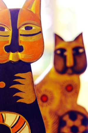 Studio shot of wooden cats as decorative itemの写真素材