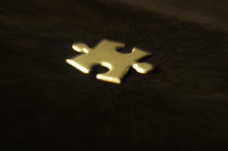 One of the pieces of jigsaw puzzle on a black backgroundの写真素材