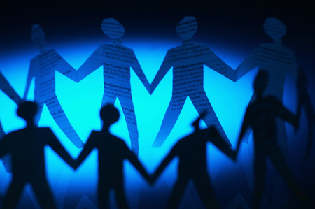 Paper cutting of people holding hands in a circleの写真素材