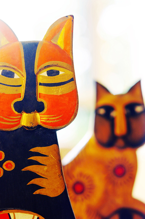 Studio shot of wooden cats as decorative itemの写真素材