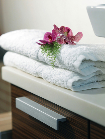 Flowers on a stack of towelsの写真素材