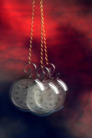 Movement of a swinging stopwatchの写真素材