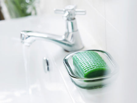 A bar of soap on the sinkの写真素材
