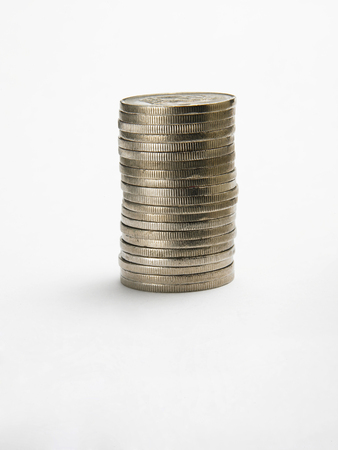 Stacks of coins on plain backgroundの写真素材