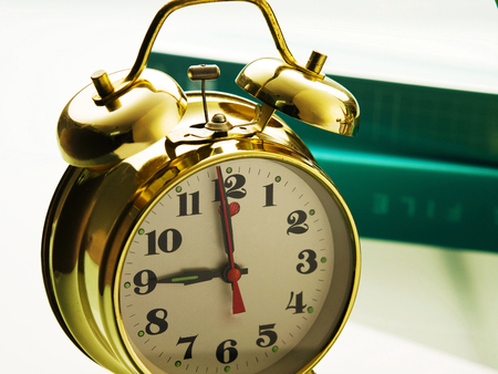 Alarm clock with some filesの写真素材