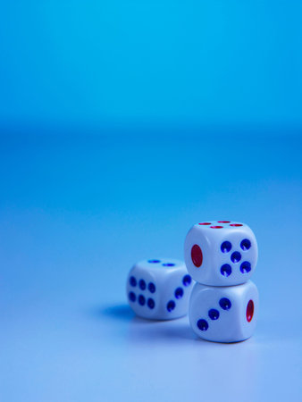 three dices on blue background