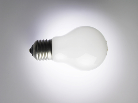 Light bulb on white backgroundの写真素材