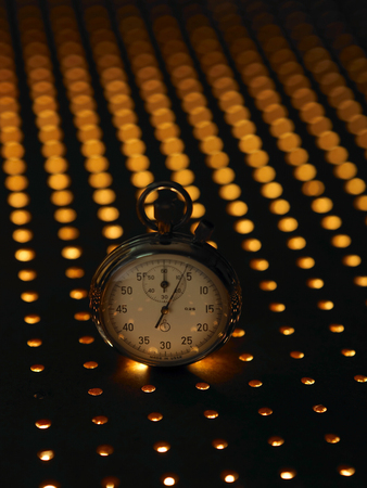 Stopwatch at dark backgroundの写真素材