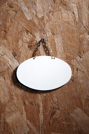 metal signage with string on the texture woodの写真素材