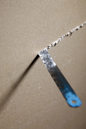 saw or cutting board into two piecesの写真素材