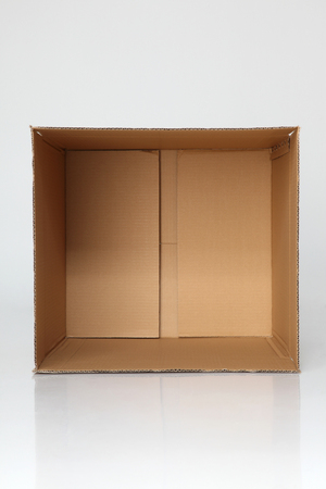 empty brown cardbox open on the plain backgroundの写真素材