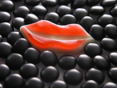 lip shape of gummy candy and chcolate candy togetherの写真素材