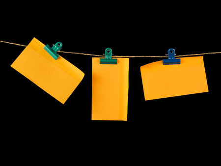 washing line clipped with different type size of paper