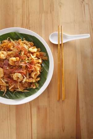 Top view of malaysian famous food Penang fried kuey teowの写真素材