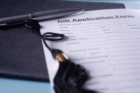 Graduation hat with application form.