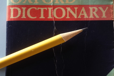 Pencil on top of the  dictionaryの写真素材