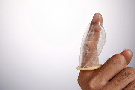 stock image of the man holding condomの写真素材