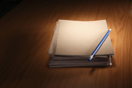 pencil resting on the blank exercise bookの写真素材